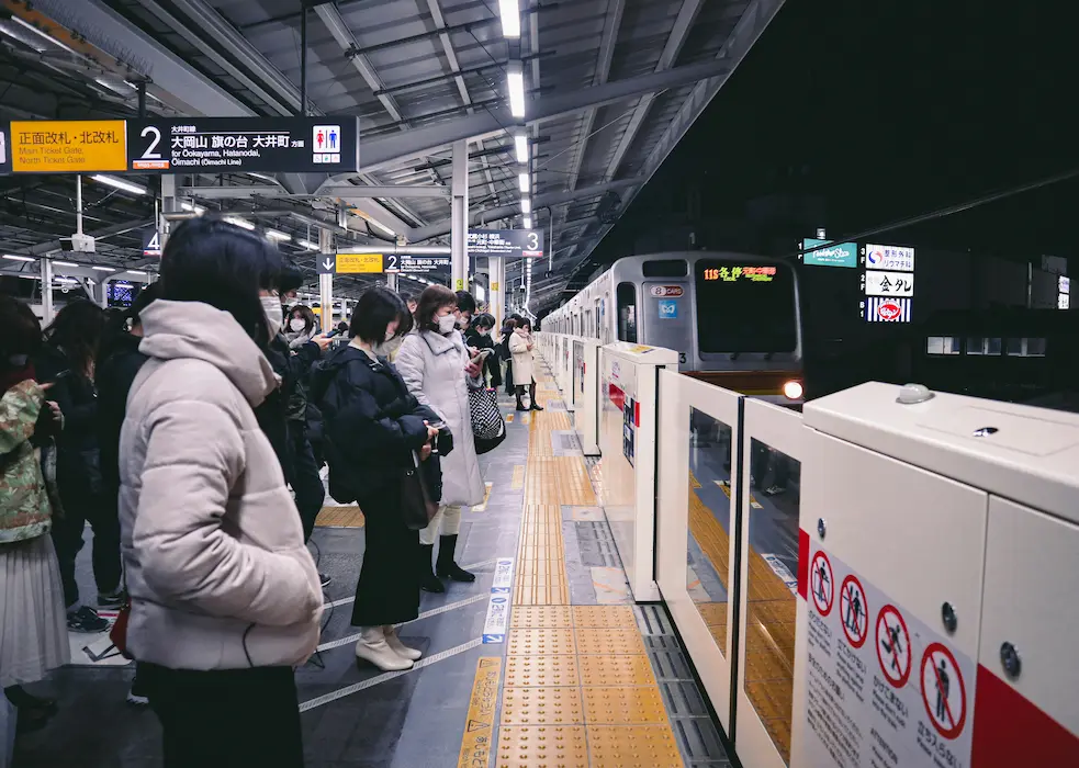 The queue is waiting for subways in Japan with kids. 