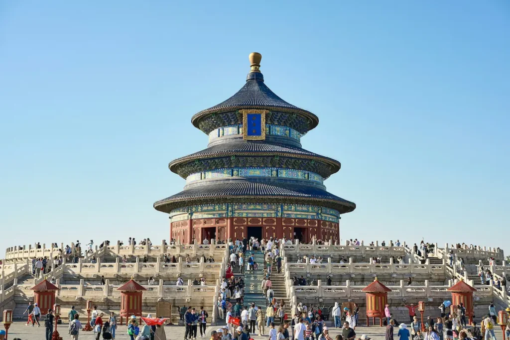 Morning at the Temple of Heaven where kids can enjoy open playground-style lawns and watch locals practicing tai chi.