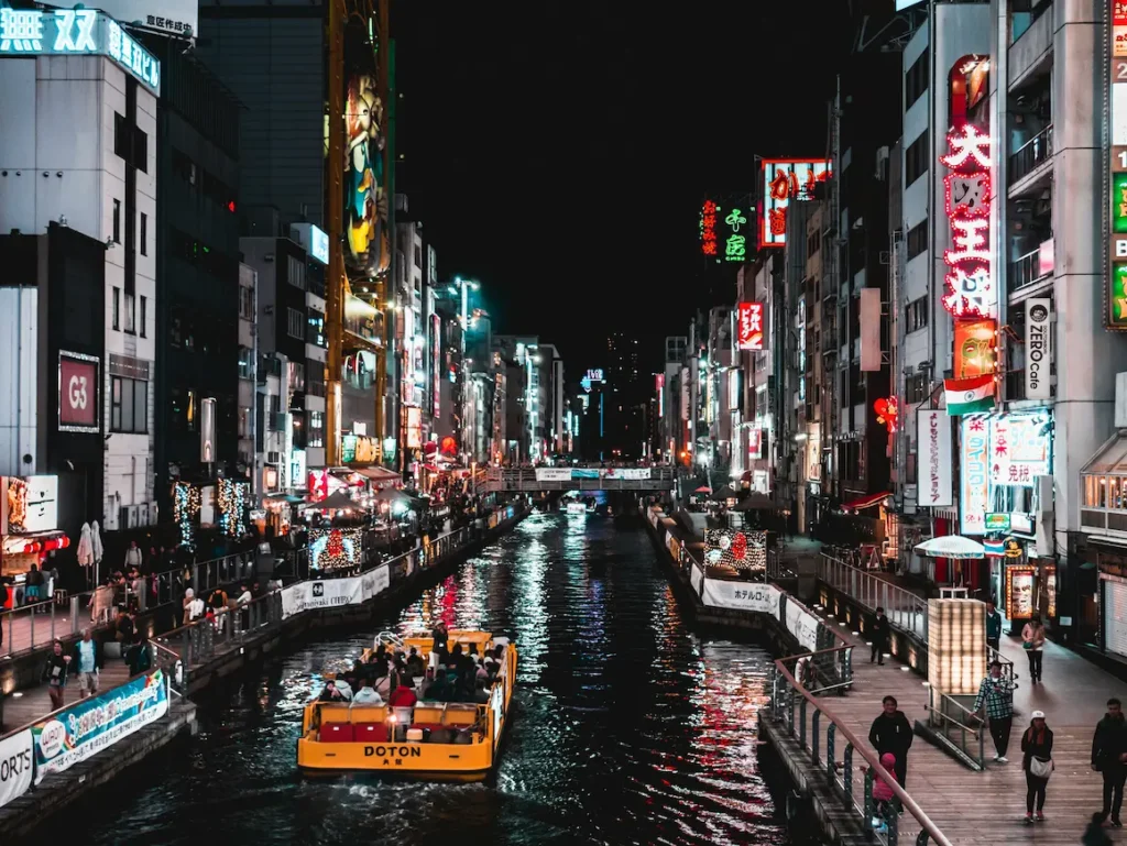 Dotonbori is all neon lights and giant food signs, somewhat busy but a once-in-a-lifetime experience for kids. 