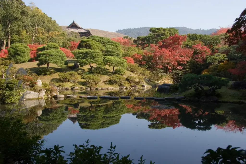 Isui-en Garden is perfect for slow walks with kids among ponds, bridges, and blooming cherry trees.