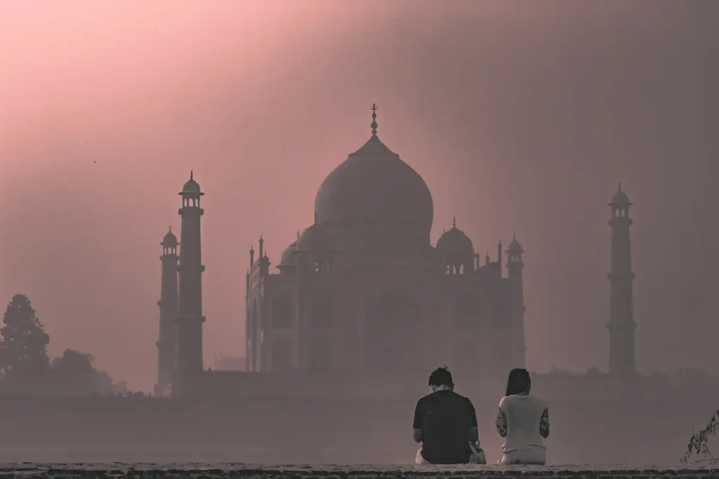 View of the Taj Mahal in foggy weather in winter.