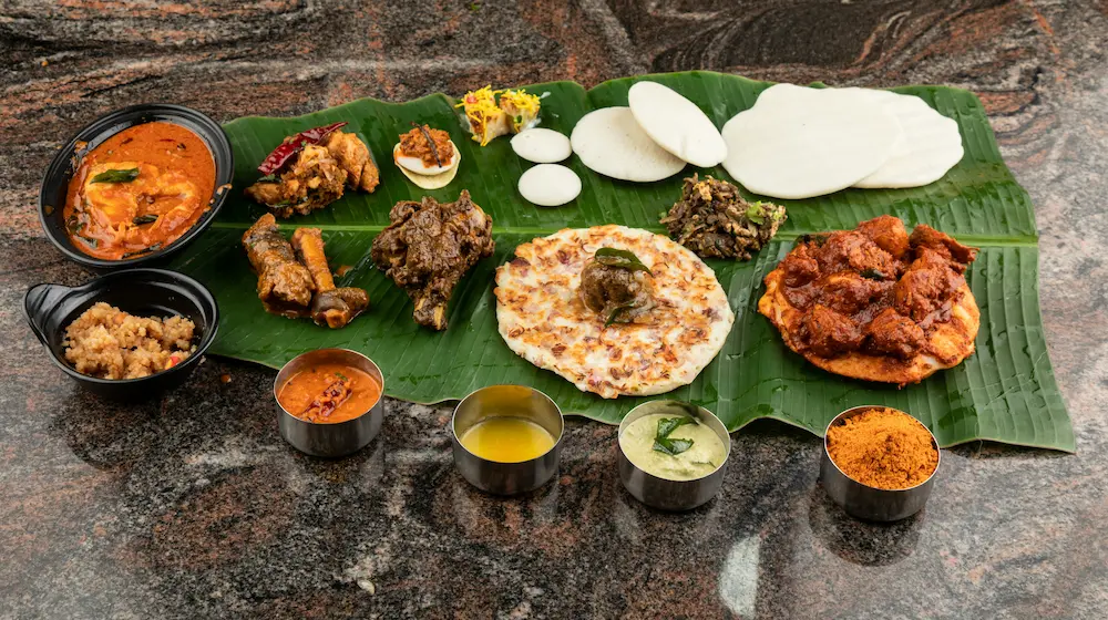 Southern Indian food leans toward coconut-based gravies, rice, and lentil dishes.