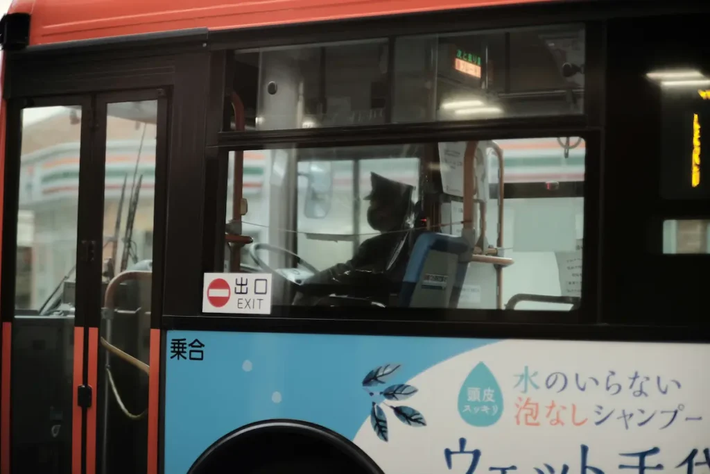 An American family visiting Mt. Fuji with kids by bus, relaxing on a Japan day trip from Tokyo.