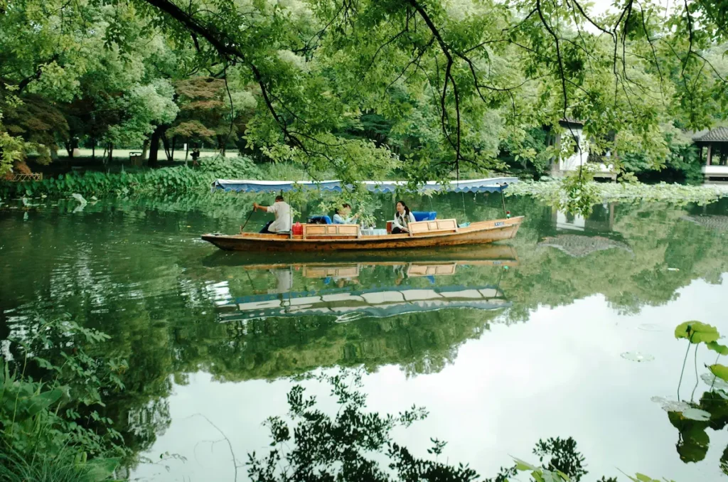 Family enjoying boat ride West Lake Hangzhou with kids