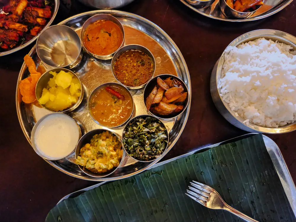Try a Kerala thali—often simply called a “meal”—served on a banana leaf with rice, several curries, pickles, and papad.