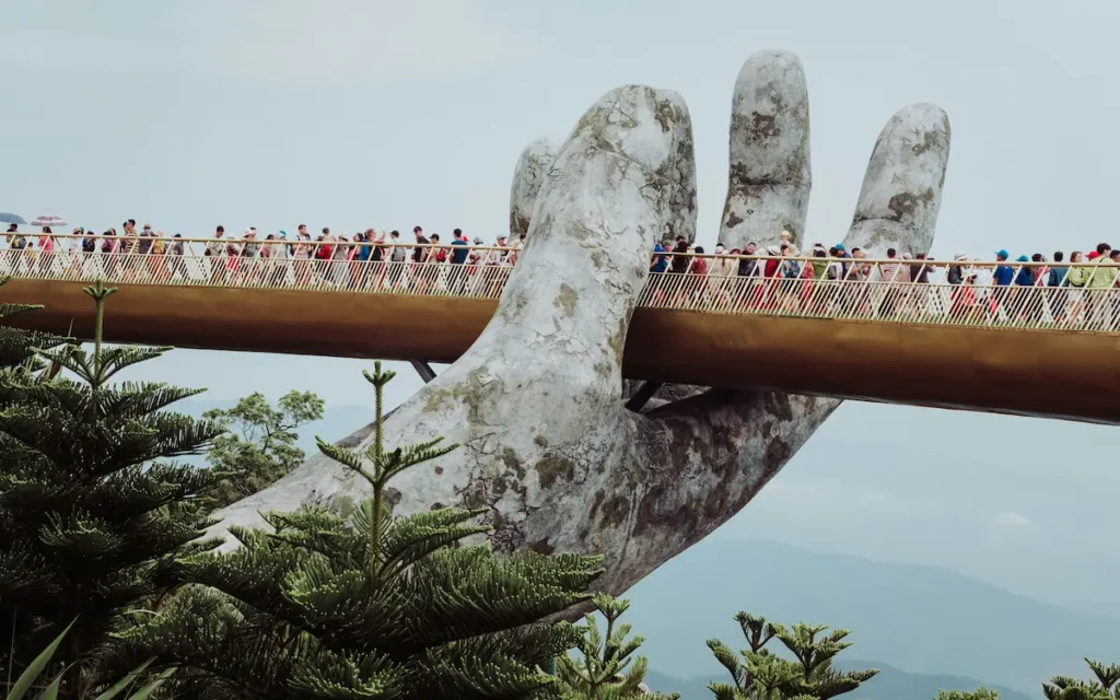 The popular Golden Bridge on Ba Na Hills is in Da Nang, Vietnam; it's best to visit with kids of all ages.