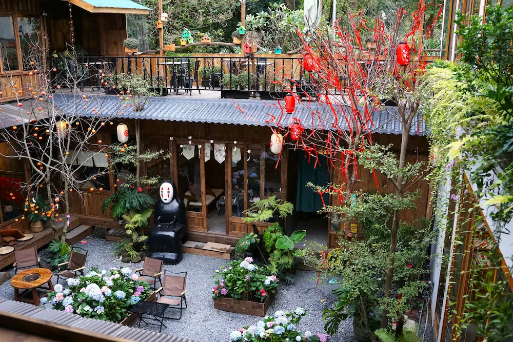 Parents enjoying egg coffee in a Hanoi café while kids drink smoothies in Old Street, Hanoi.