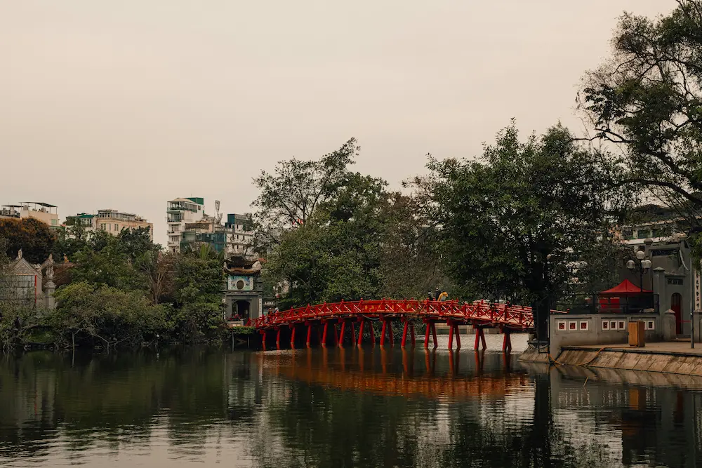 The red bridge connecting the Ngoc Son Temple on Hoan Kiem Lake with kids in Hanoi. 