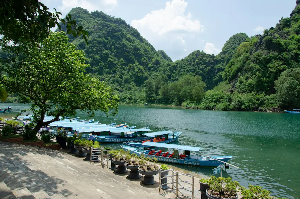 Wooden boat trip along the Son River into Phong Nha Cave, Phong Nha, Vietnam.