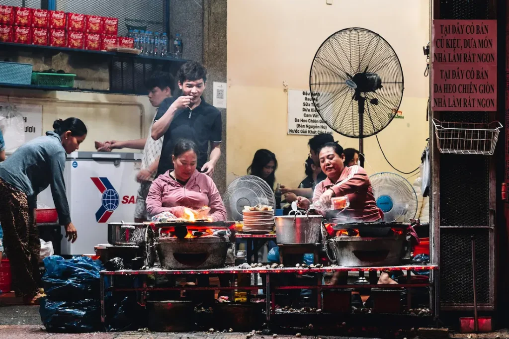 Local women are sitting outside the Nha Trang restaurant. 