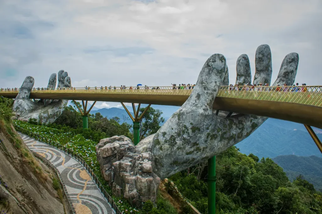 The popular Golden Bridge on Ba Na Hills, Da Nang, Vietnam, is best visited from March to September. 