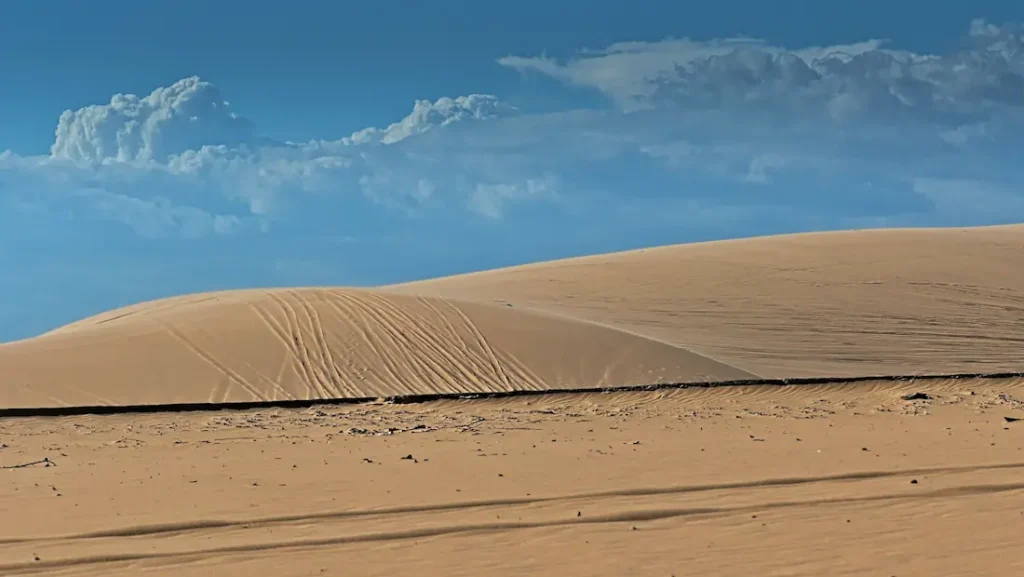 The white sand dunes of Mui ne popular for sand surfing orquad bike tour.