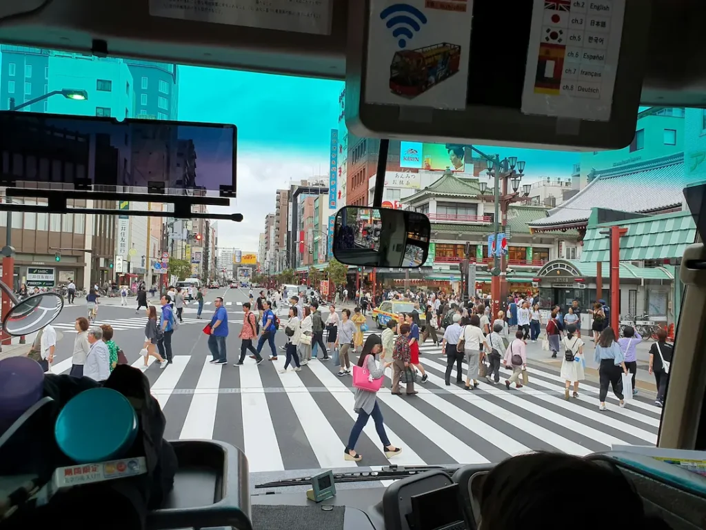 Family walking near Shibuya Crossing in Tokyo.