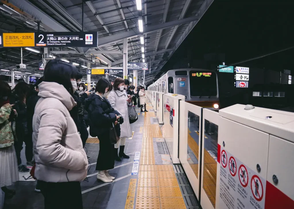Family traveling on Japanese trains with young children.