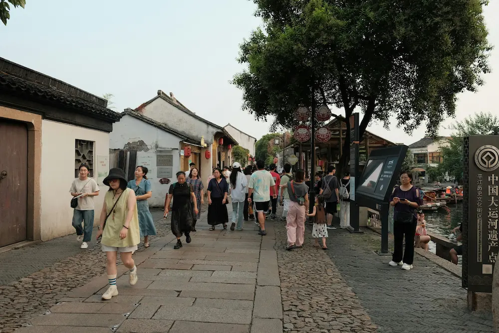 family walking back through streets in China