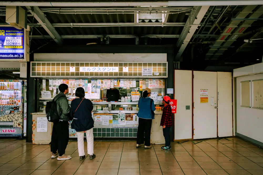 Using cash at Japanese train station ticket machine