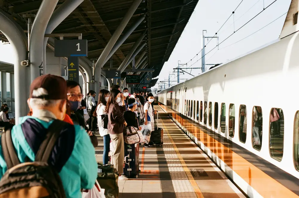 parents waiting for train in Tokyo