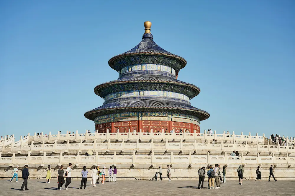 family looking at a large historic landmark in China together