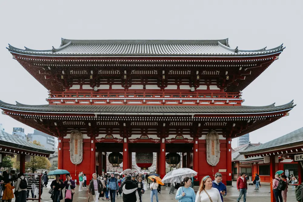 Using a baby carrier at a Japanese temple with kids is easier than a stroller.