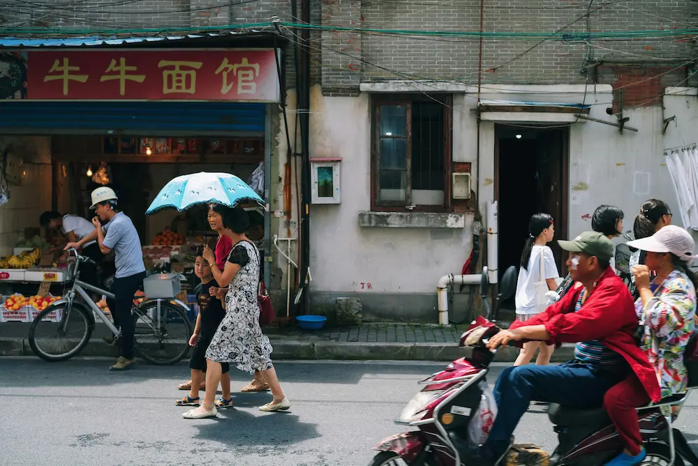 Parents navigating streets while traveling with kids in China