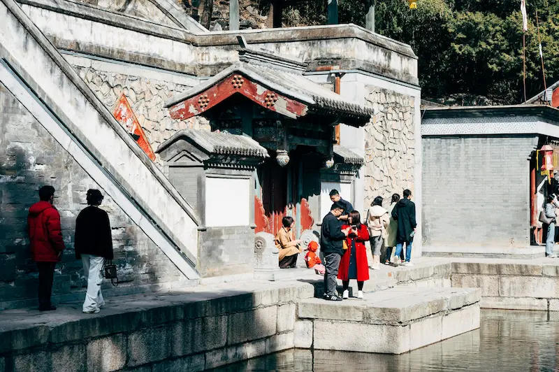 local people interacting with child in China