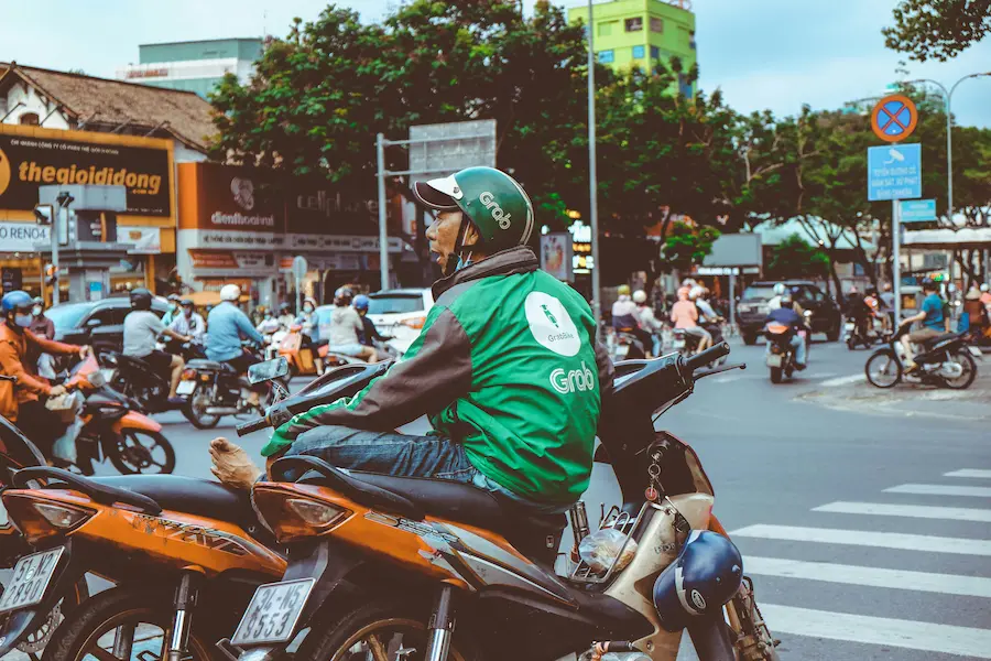 Grab a rider waiting in Ho Chi Minh City with kids. 