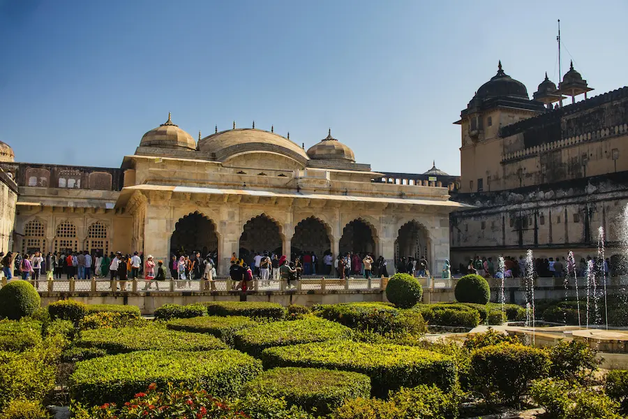 Family traveling safely in India with a toddler at a historical site.