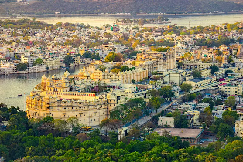 Kids enjoying the view of beautiful palaces of Udaipur, Rajasthan.