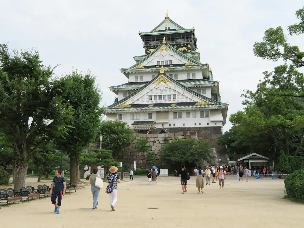 Family enjoying Osaka Castle with young children in Japan