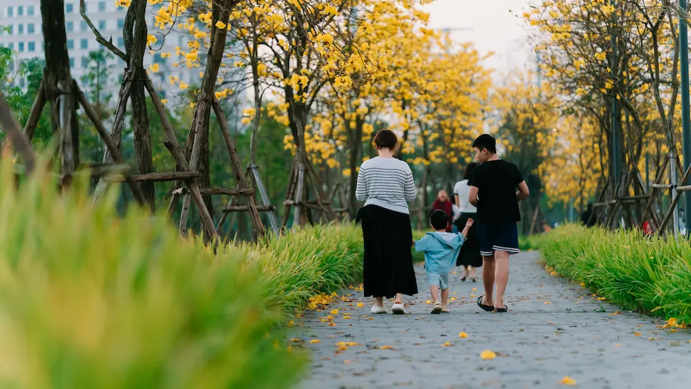 family walking in tokyo's park after long flight jet lag, kids, and daylight reset