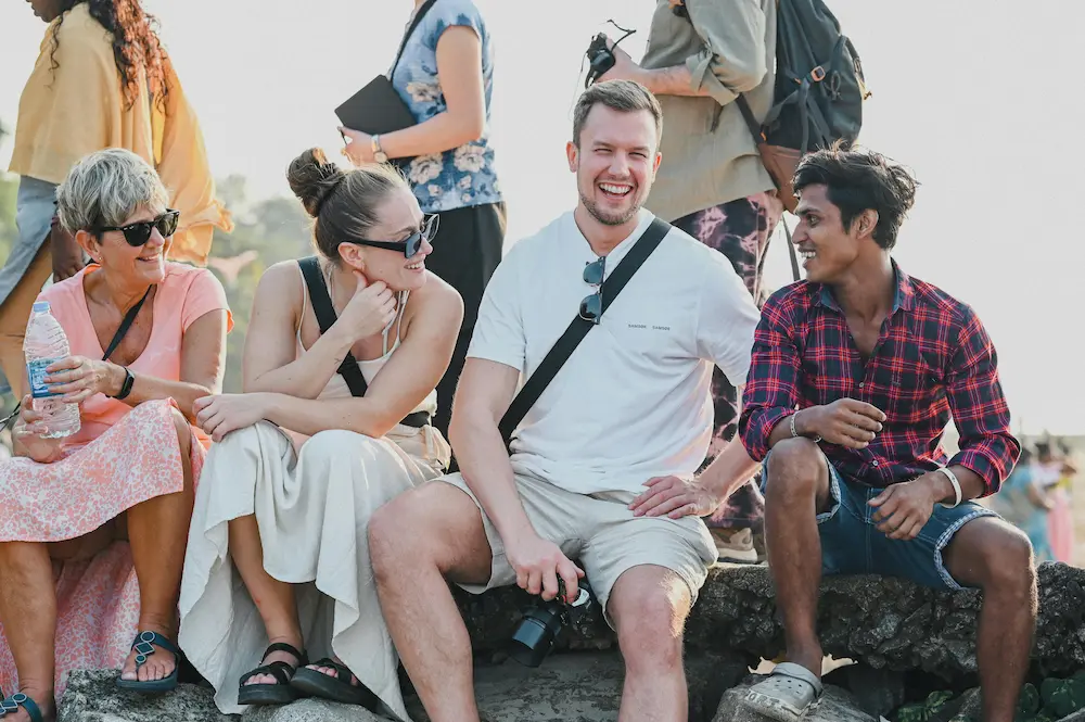 family talking to locals in India.