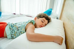 tired child sleeping during travel jet lag with kids
