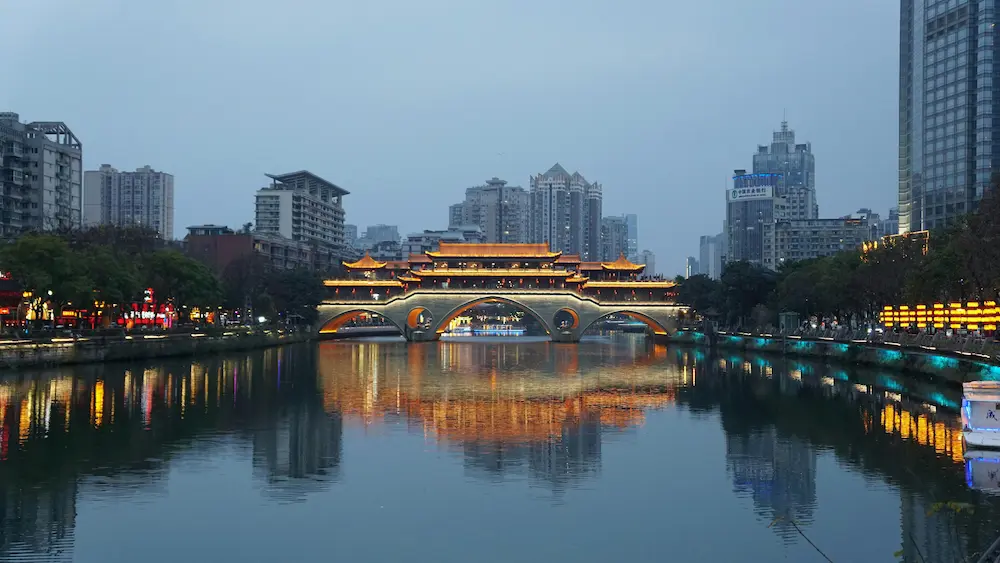 Families enjoying the beautiful lightning of Dongmen Bridge, Chengdu, China. 