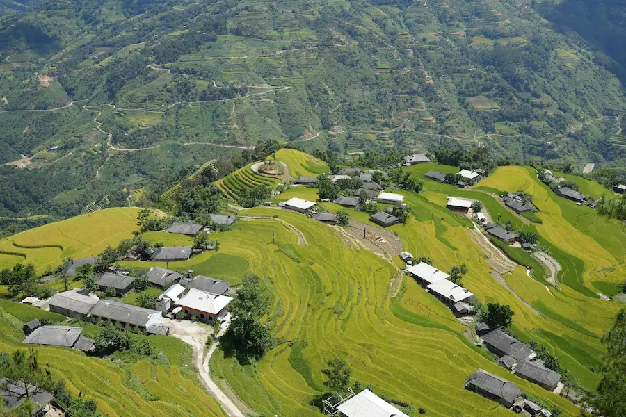 View of misty rice terraces from a family friendly countryside homestay in Ta Van village Sapa.