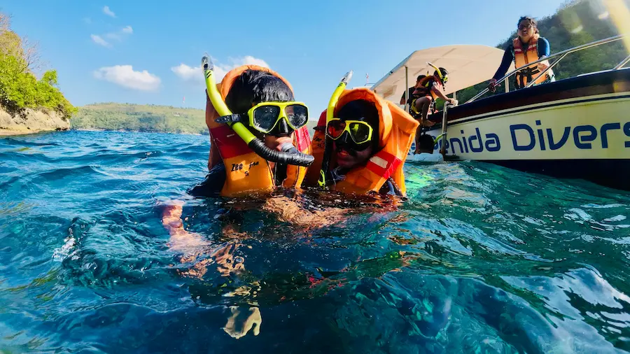Bali snorkeling kids blue lagoon fish shallow water family