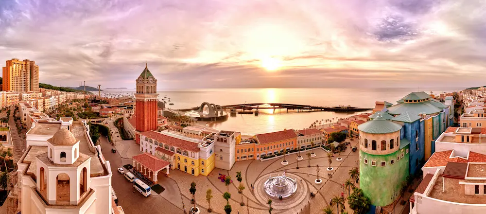 family enjoying Sunset Town Phu Quoc colorful buildings and cable car views 