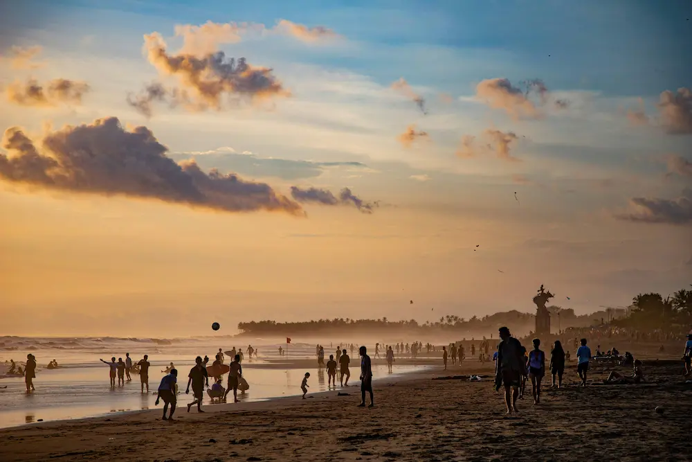 Seminyak Bali beach family sunset kids playing sand