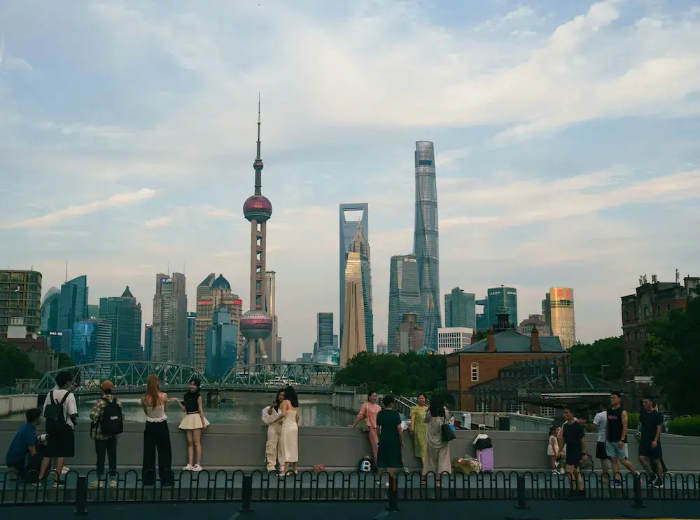Lightweight travel stroller on the wide sidewalks of The Bund in Shanghai with Pudong skyline in background