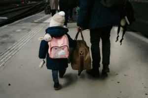 mother handling toddler during travel journey