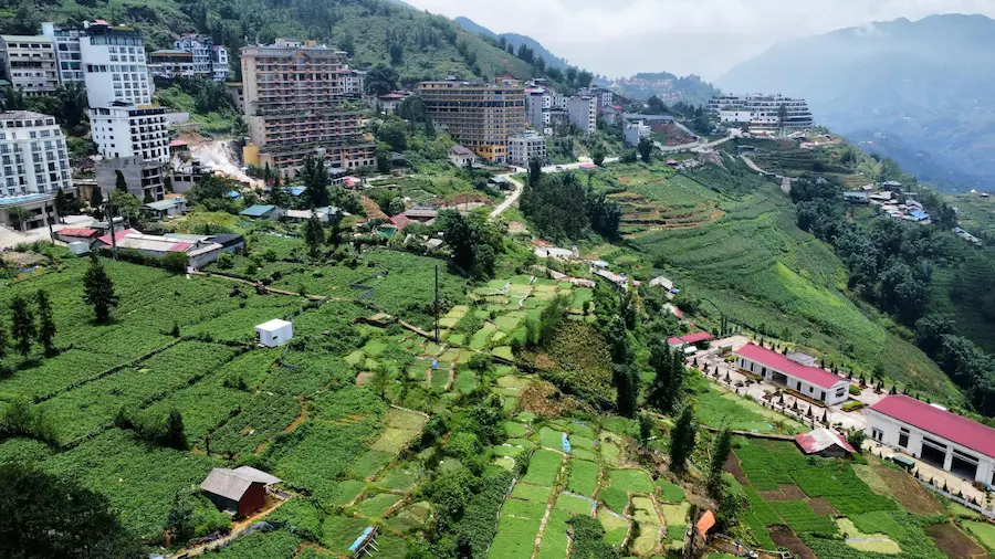 Family exploring rice terraces in Sapa Vietnam with children