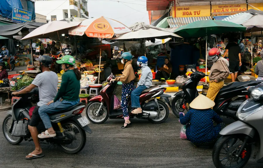 Scooters crossing in the PHU QUOC MARKET AREA