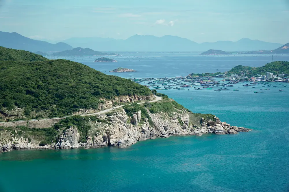 Coastal scenery viewed from a Vietnam train window near central Vietnam.