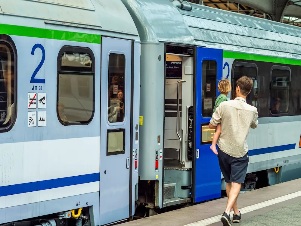 Family boarding a Vietnam sleeper train for an overnight journey with kids