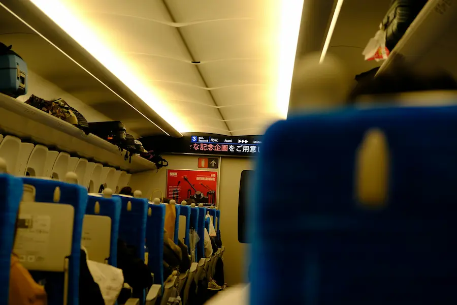 family onboard a Japanese bullet train, the Shinkansen, with young kids