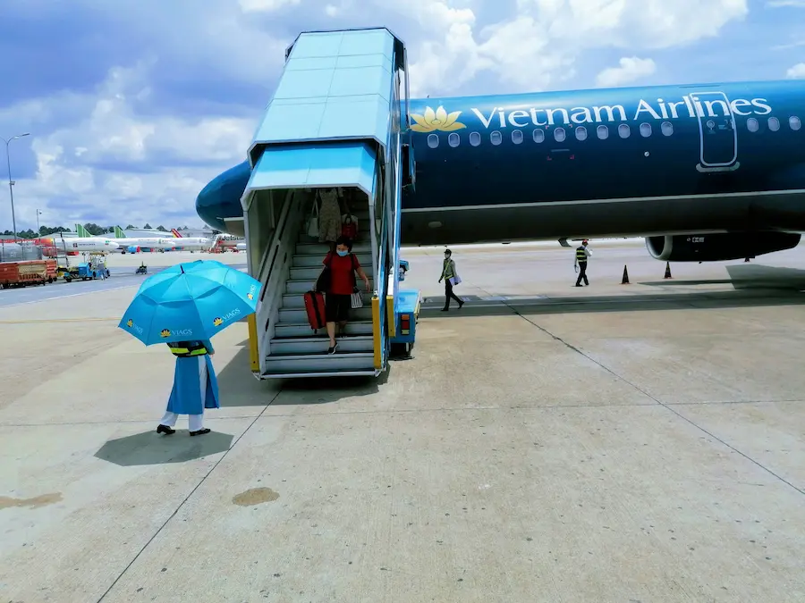 Vietnam Airlines plane and Vietnam sleeper train comparison for family travel