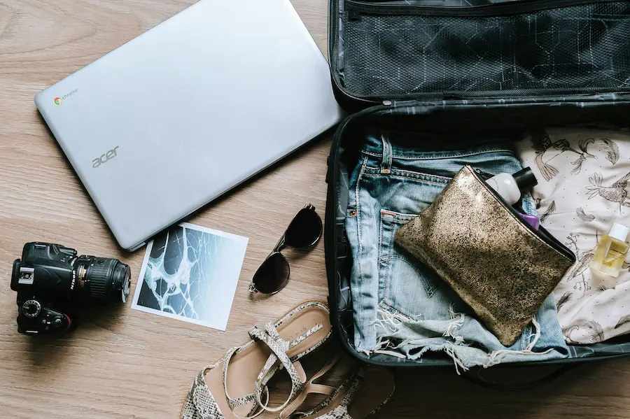 Parents packing clothes and travel essentials as per Asia packing list for families