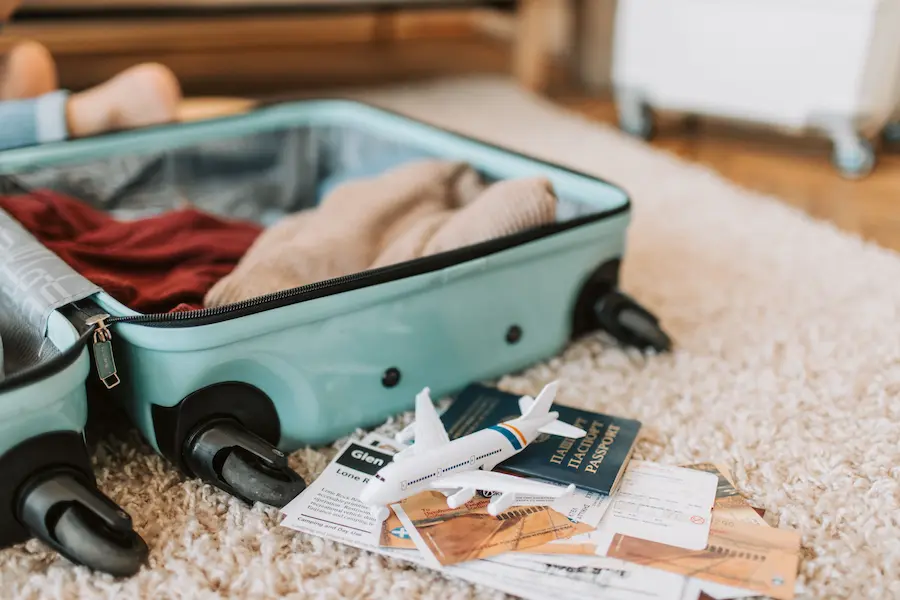 Mom is packing travel documents safely for an Asia vacation with kids