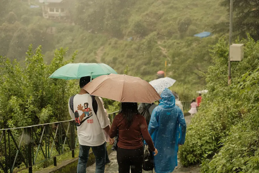 parents offguard in Bali's rain; that's why your Asia packing list for families need thoughtful planning