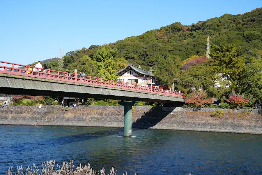 Family walking along the Uji River in Japan